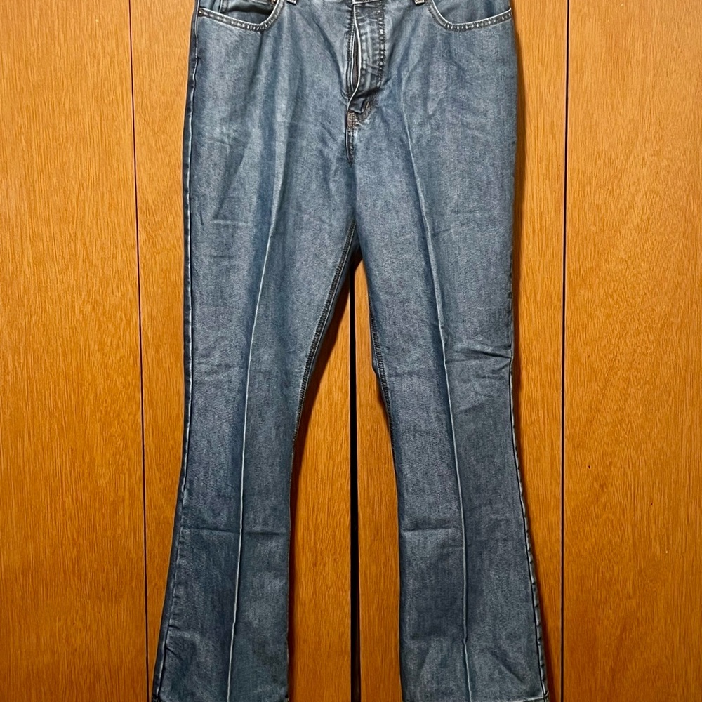 London Jean light blue sateen finish boot cut jean. Runs small.